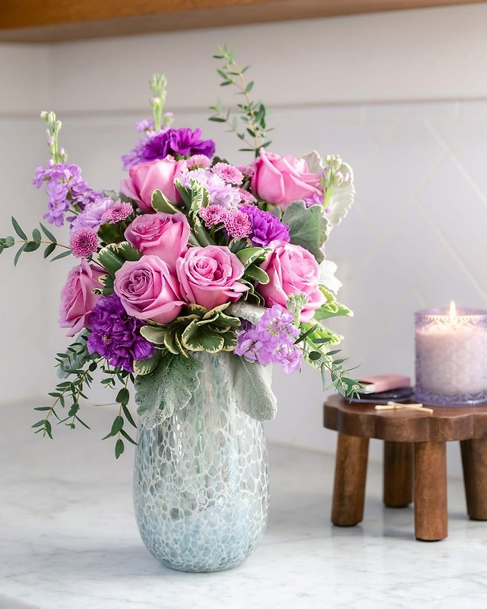Assorted Spring flowers in speckled vase